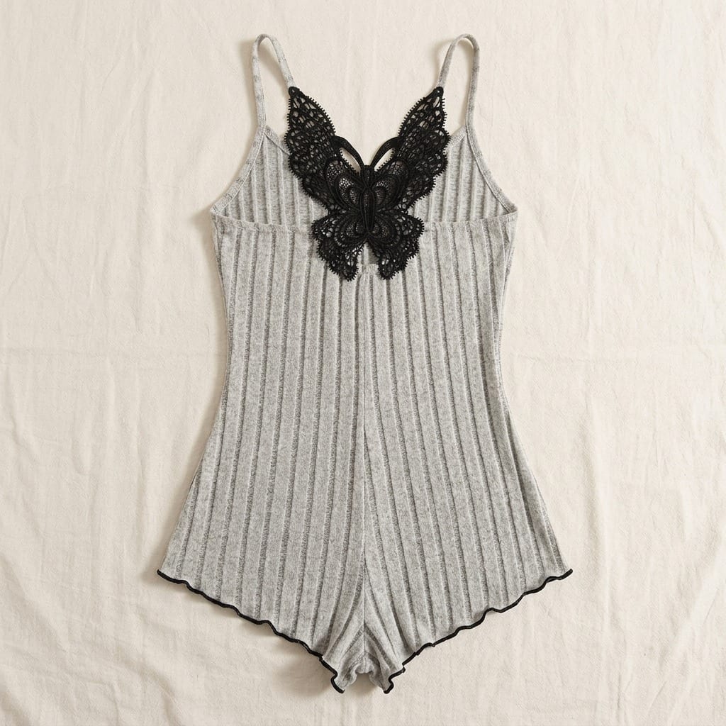 The Viola Ribbed Sleep Romper in Burgundy in Grey, on a wooden hanger
